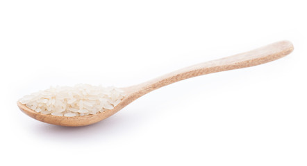 Rice in wooden spoon on white background