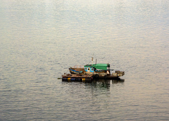Fototapeta na wymiar a small boat in the middle of the water