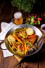 Grilled chicken wings with caramelized carrots