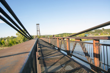 Fototapeta na wymiar the river Kondoma,suspension bridge,Russia