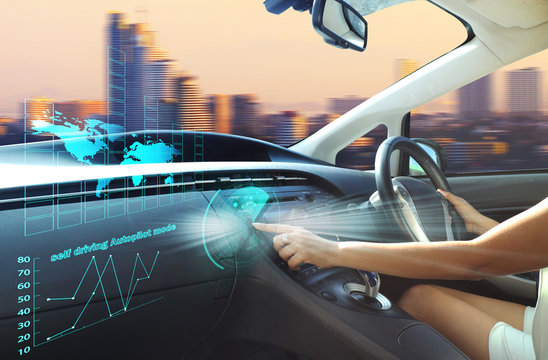 self-driving autopilot mode , autonomous car, vehicle running self driving mode and a woman driver