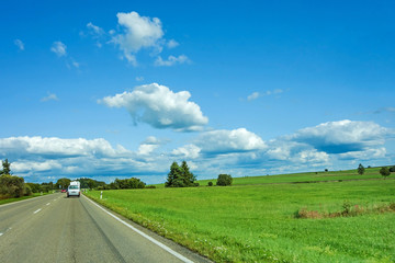 road through green rural landscape