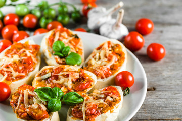 Spicy bruschetta with tomatoes and basil, traditional italian appetizers