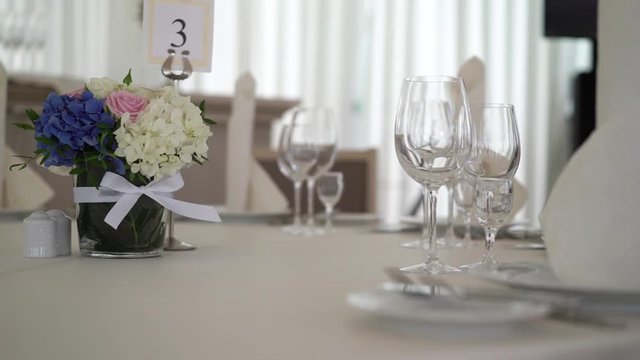 Flowers composition on wedding table indoors