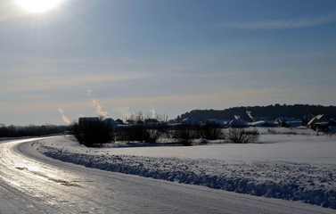 Fototapeta premium Дым из трубы домиков в мороз