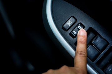 Finger push lock button of car doors.