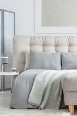 Beige bed with pillows