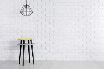 Creative table against brick wall