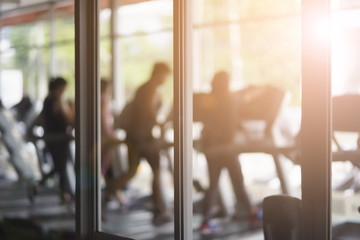 Background blur, gym fitness blur background with background light.