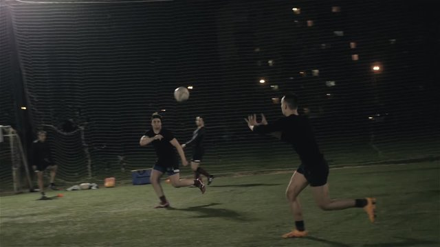 Rugby players tackling during game at the park, professional match
