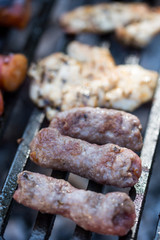Selective focus on minced meat kebabs on the barbecue grill