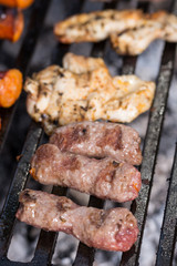 Selective focus on minced meat kebabs on the barbecue grill
