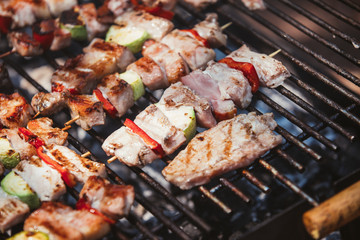 Roasted meat cooked at barbecue. Grill on charcoal and flame.