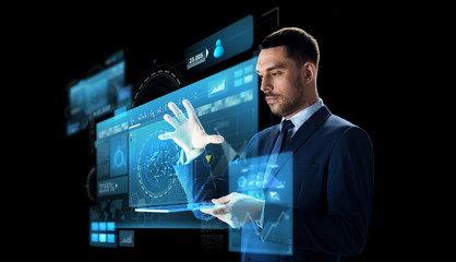 businessman with tablet pc and virtual screen