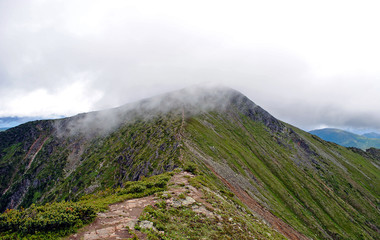 Summer mountain landscape. View of the hills and meadows on Lake Baikal, Russia