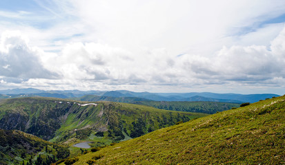 Obraz premium Summer mountain landscape. View of the hills and meadows on Lake Baikal, Russia