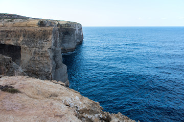 Fototapeta na wymiar Wied il Mielah canyon, natural arch over the sea. Gozo, Malta