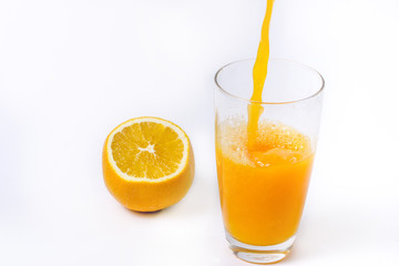 splashing orange juice with oranges against white background By showcake