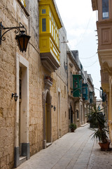 Fototapeta na wymiar Narrow street in Mosta, Malta