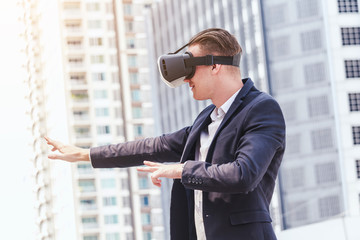 Young man enjoy with virtual reality glasses