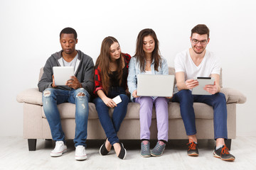 Diverse young students preparing for exam at home