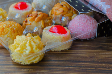 Different Panellets on wooden background. Typical sweets consumed at All Saints Day (Dia Todos Los...