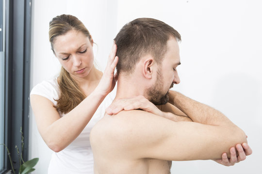 Physiotherapist helping to do exercises