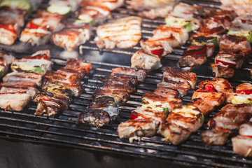 Roasted meat cooked at barbecue. Grill on charcoal and flame.