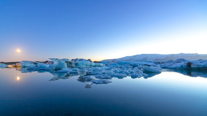 Fototapeta na wymiar Icebergs in Jokulsarlon glacial lake at sunset, Iceland