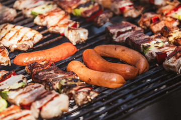 Roasted meat cooked at barbecue. Grill on charcoal and flame.