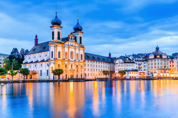 Lucerne, Switzerland. Jesuit Church along the river Reuss in the old town. - obrazy, fototapety, plakaty