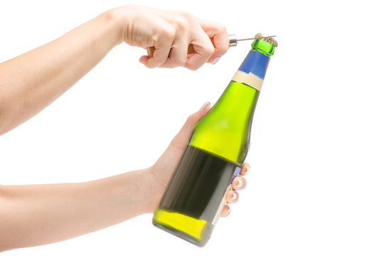 Female hands with a bottle of beer with open