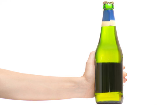 Female hands with a bottle of beer