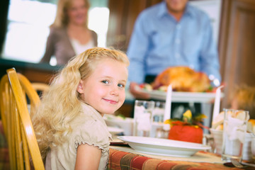 Thanksgiving: Smiling Girl Waits Patiently For Turkey Dinner