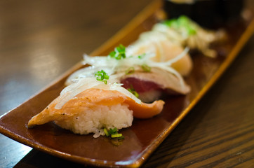 Japanese cuisine salmon aburi sushi. salmon burn with mayo sauce on plate