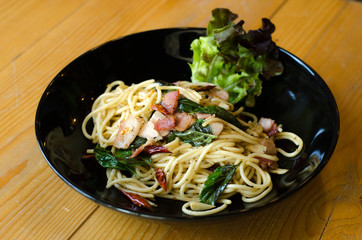 Spaghetti with bacon, parsel and parmesan cheese. Pasta Italian food concept.