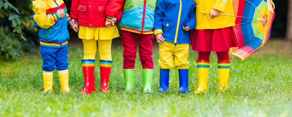 Kids in rain boots. Rubber boots for children.
