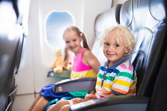 Kids flying airplane. Fligh with children.
