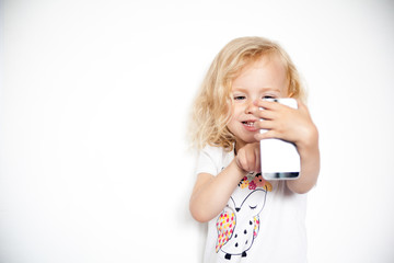 Little beautiful girl with her smart phone