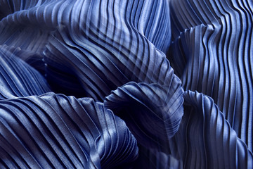 Blue pleat fabric background is a beautiful curved wave.