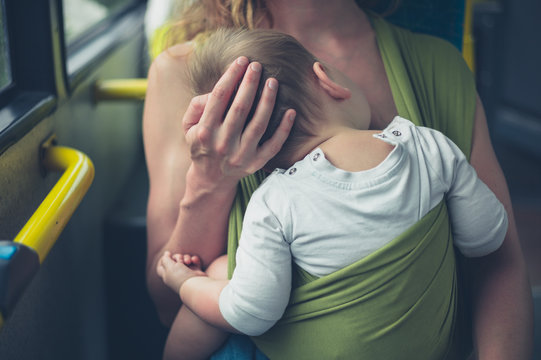 Mother Breastfeeding Baby On The Bus