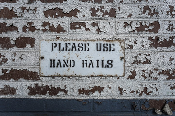 Sign on brick wall
