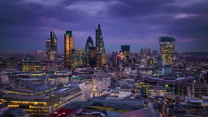 Gordijnen Londen London, England - Panoramic skyline view of Bank district of London with the skyscrapers of Canary Wharf at the background at blue hour  © zgphotography