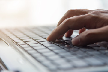 Hand typing Keyboard online internet concept, selective focus