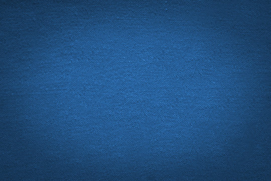Blue cloth texture Background with black gradient vignette