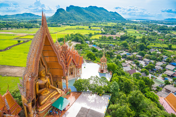 Fototapeta premium Wat tham sua, thailand temple landscape landmark in kanchanaburi, thailand travel concept background. Wat tham sua or tiger cave temple is the famous tourist attraction in kanchanaburi, thailand.