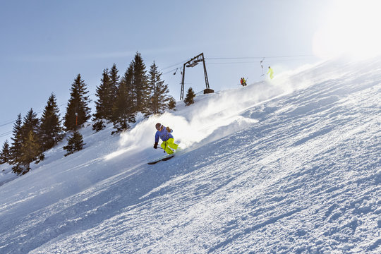 Ski holiday, Skier carving downhill, Sudelfeld, Bavaria, Germany