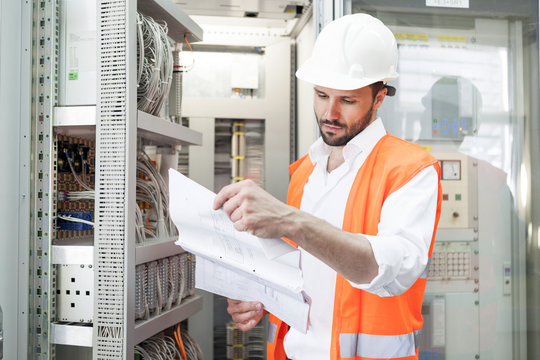Engineer checking electricity substation
