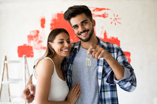 Couple holding key of there new house