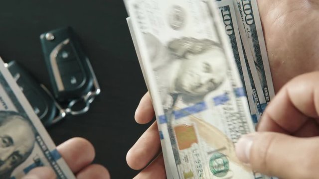 Close-up of a counting money - buying car. People stock footage shot. 